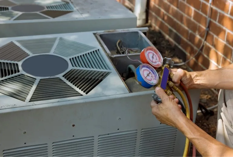 Air conditioner outside a home in a residential neighborhood undergoing AC repair and maintenance by Paradise Heating an