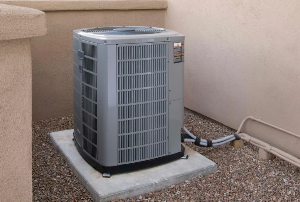 AC repair and maintenance service by Paradise Heating and Air, troubleshooting a leaking air conditioner in a residential neighborhood