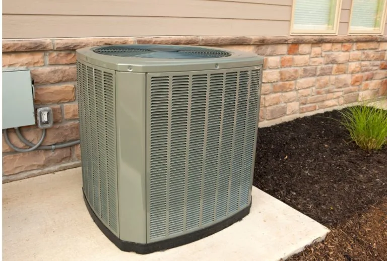 Air conditioning or heat pump outside a home, providing efficient heating and cooling solutions. Learn how to choose the