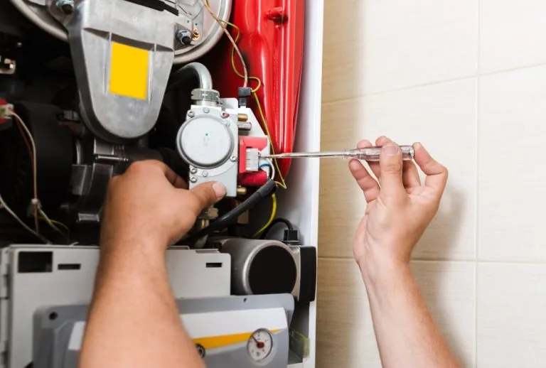 HVAC technician installing or repairing a furnace, ensuring proper sizing and efficient heating for a home, with expert 