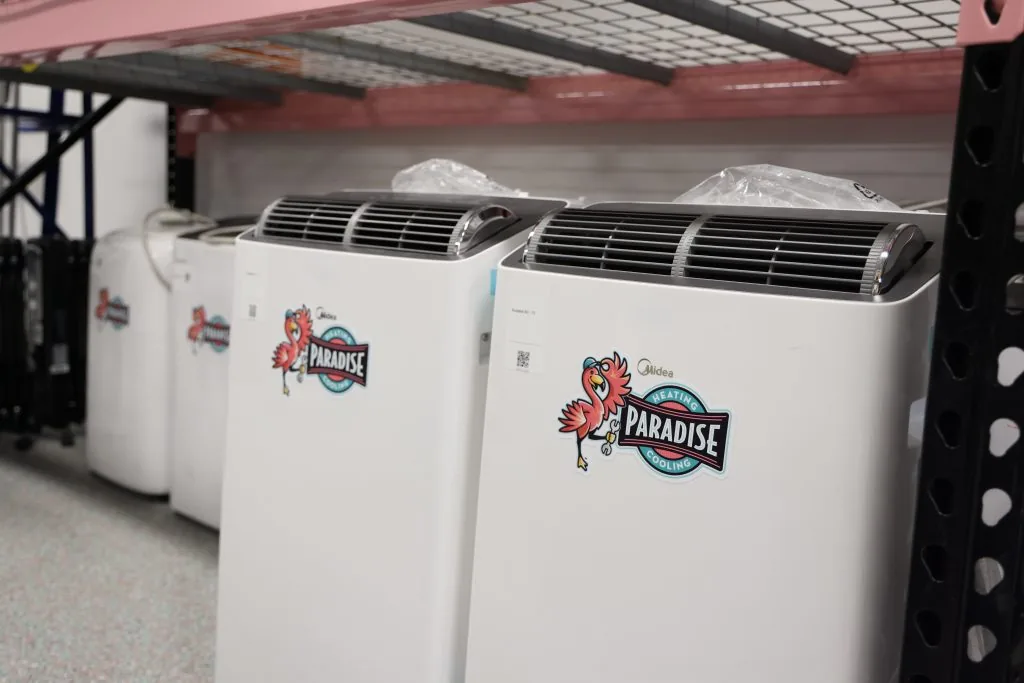 Air conditioners with Paradise Heating and Air logo