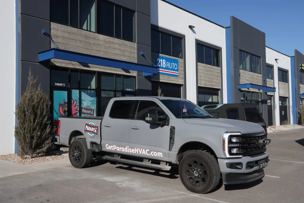 Paradise Heating and Air branded HVAC service vehicle with company logo, representing professional HVAC services, AC repair, furnace installation, heating and cooling maintenance, and air conditioning replacement