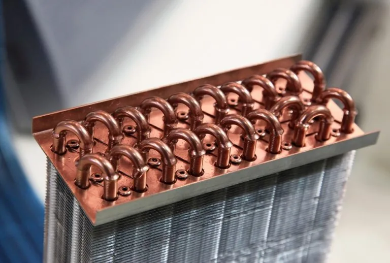 Close-up of a furnace heat exchanger, a critical component for efficient heating in your home. Paradise Heating and Air 
