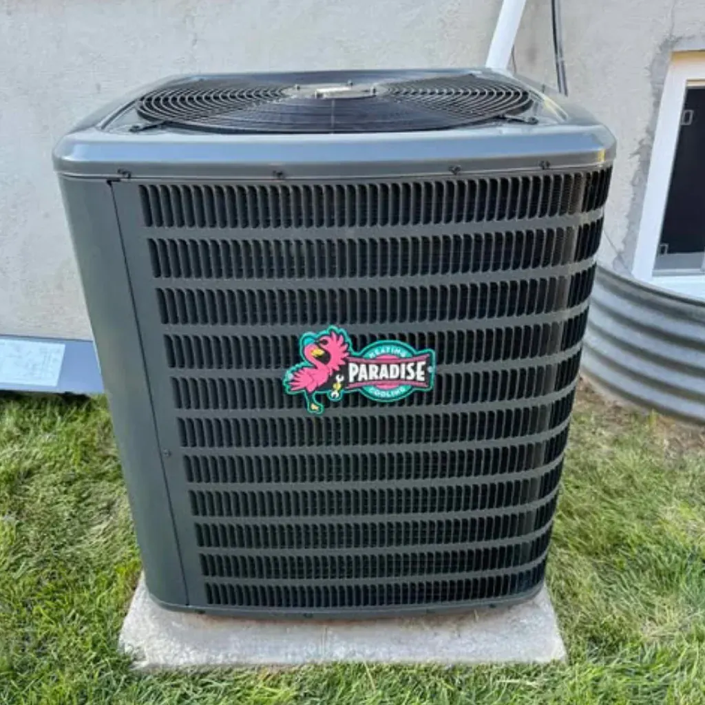 Professional AC installation by Paradise Heating and Air outside a residential or commercial building, featuring a high-efficiency HVAC system with the company’s logo