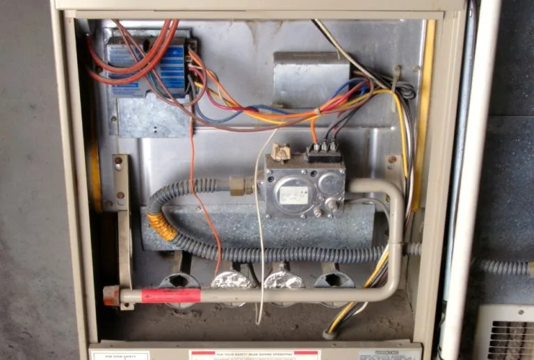 Furnace inspection in a home by Paradise Heating and Air, offering furnace repair and maintenance services for issues li