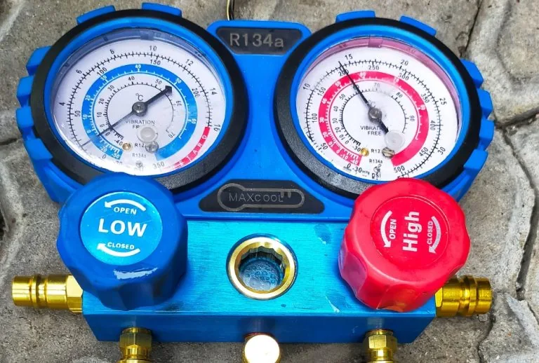 Close-up of an air conditioner refrigerant gauge, showing AC leak detection and repair, refrigerant recharge, and mainte