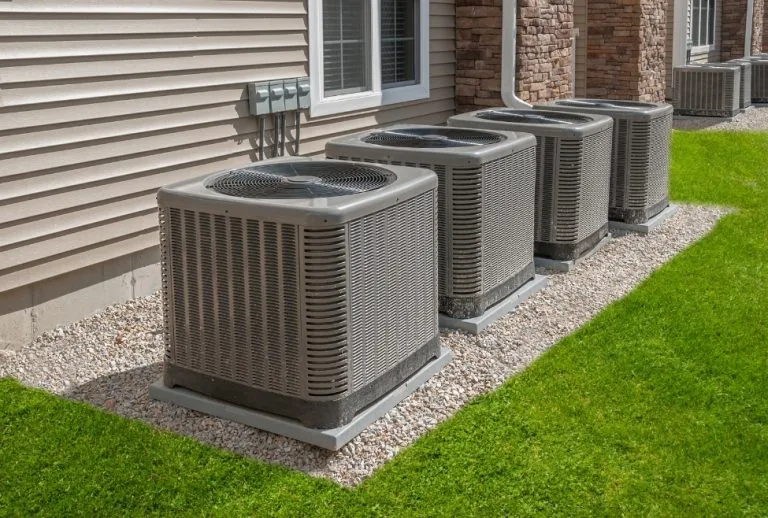 Air conditioner units showing potential signs of a bad AC compressor, used for AC repair, compressor replacement, and co