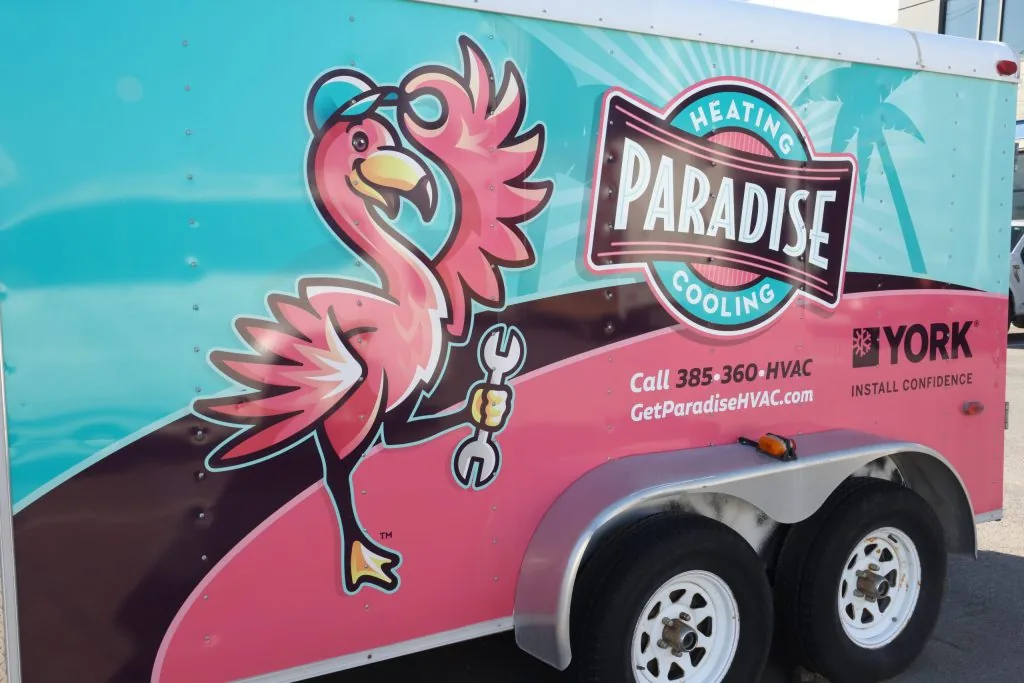 Paradise Heating and Air service vehicle outside a residential home providing professional HVAC services in Roy