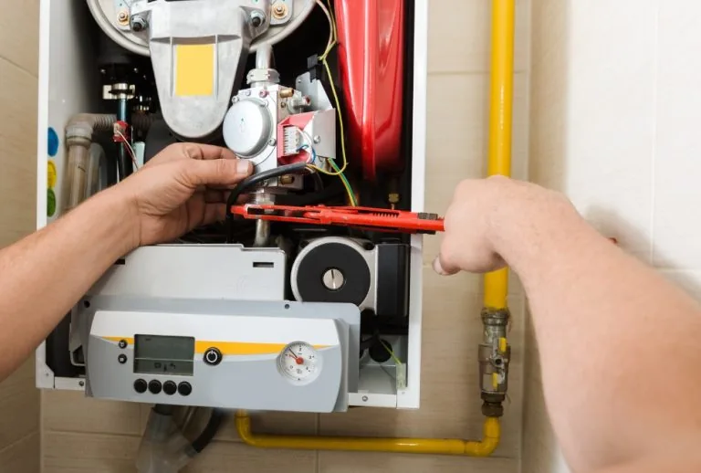A furnace unit showing common signs of furnace ignitor failure, helping homeowners understand how to know if a furnace i