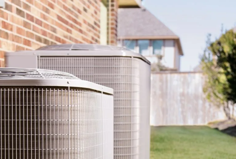 Air conditioning unit showing signs of low refrigerant, illustrating how to tell if my AC is low on refrigerant, includi