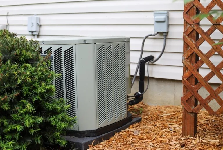 Outdoor air conditioning unit illustrating standard AC repair costs, showing common HVAC issues like AC not cooling, com