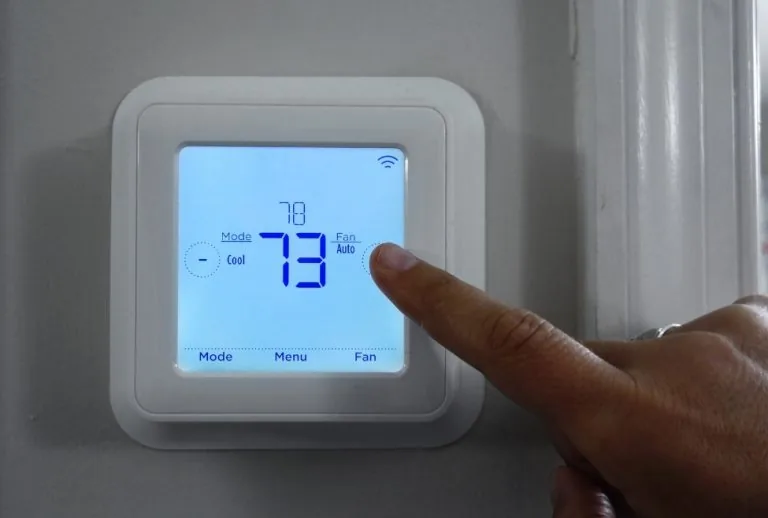 Thermostat displaying a cool on blinking message, indicating possible AC startup delays, thermostat problems, electrical